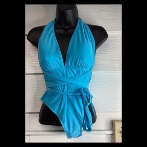 Bright blue halter top tie, side, one piece swimsuit.